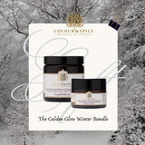 logo colour-and-spice met de producten golden bloom en uplifting moisturizer op winterse achtergrond 